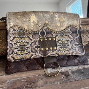Up-cycled Louis Vuitton material crossbody/clutch.